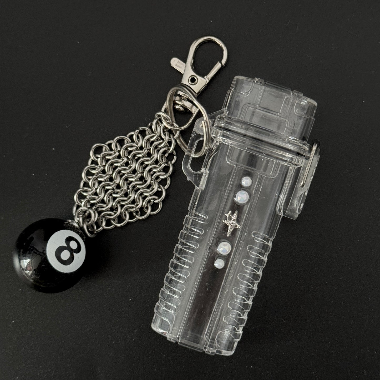 photo of lay flat lighter case keychain with chainmaille 8 ball charm