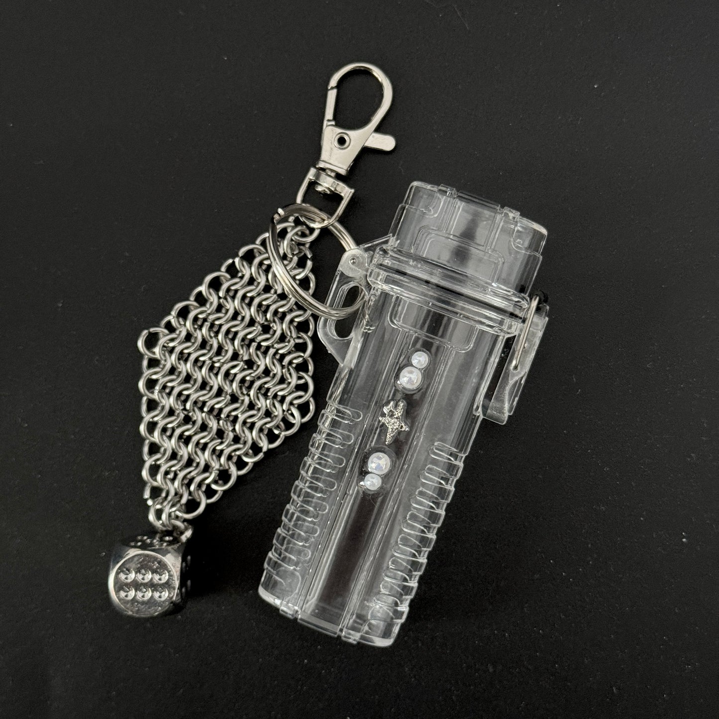 lay flat photo of lighter case keychain with chainmail and dice charm